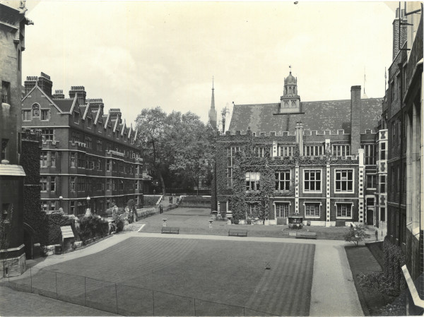 Photograph of the garden from the embankment showing the lawn being mown and prepared for tennis, c.1920-c.1935 (MT/19/PHO/4/1/8)