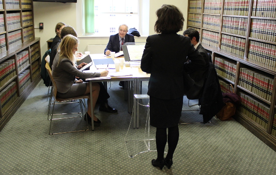 Master Kearns judging a moot heat in the Rosamund Smith Mooting Competition