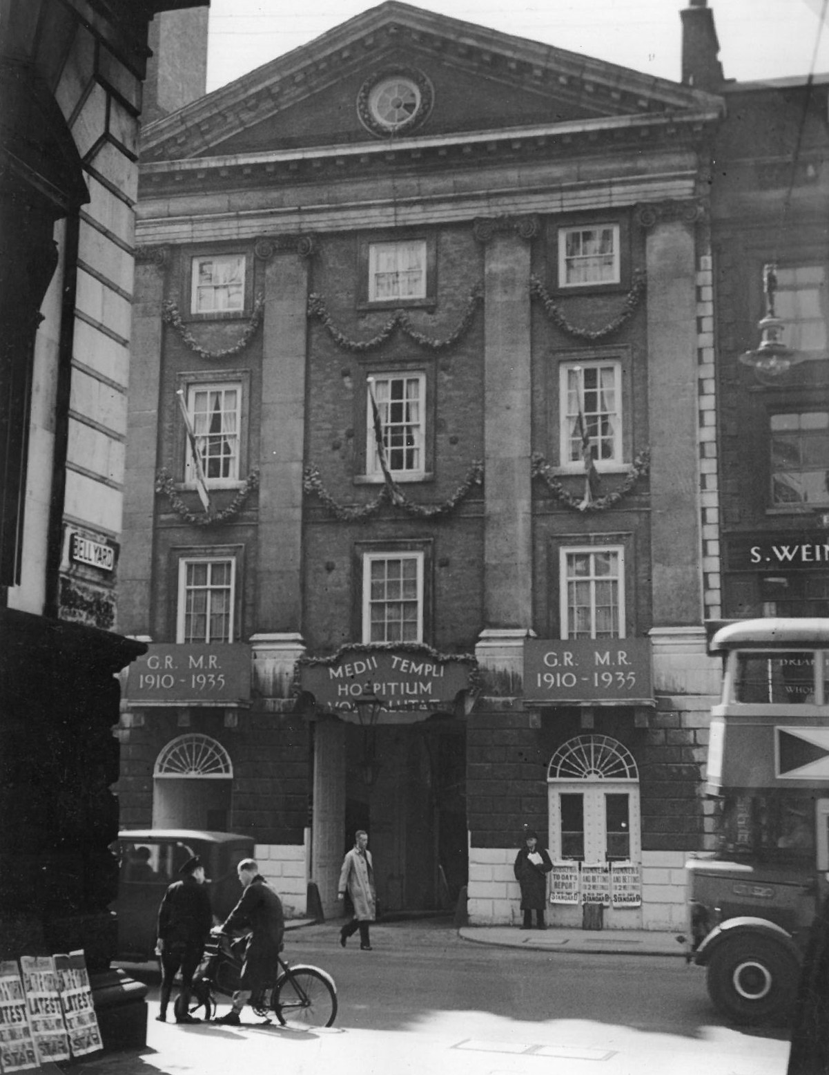Bus and Bicycle outside of Temple Gate on Fleet Street