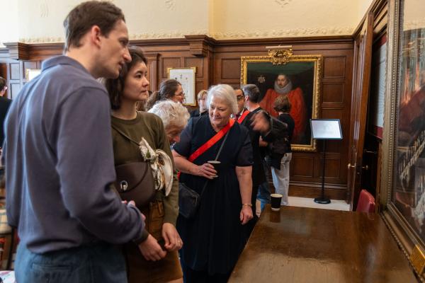 Master Brennan with visitors admiring the Inn's art work