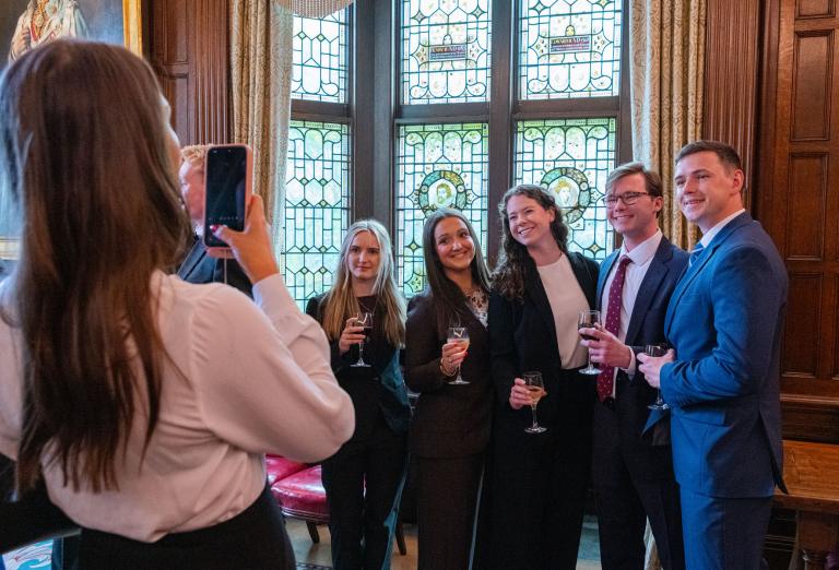 Guests at reception enjoying taking photos
